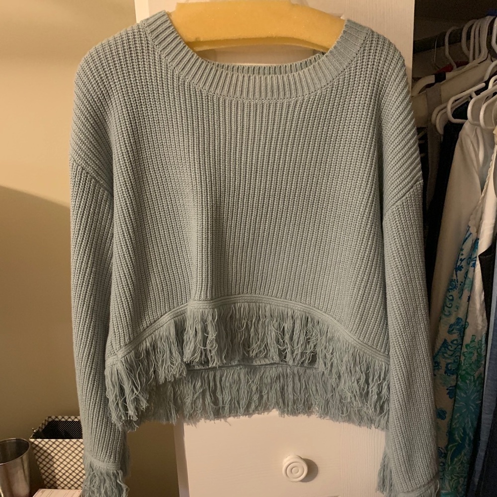 Cropped sweater with fringe